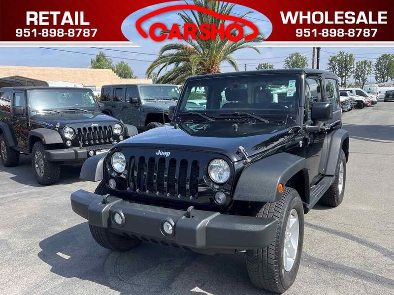 2014 Jeep Wrangler — a typically priced live listing