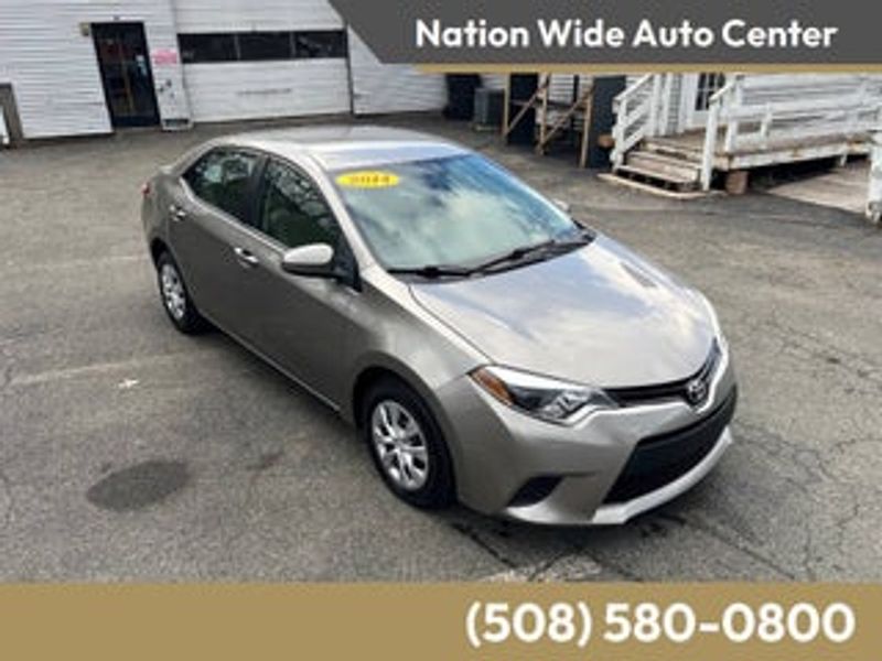 2014 Toyota Corolla — a typically priced live listing