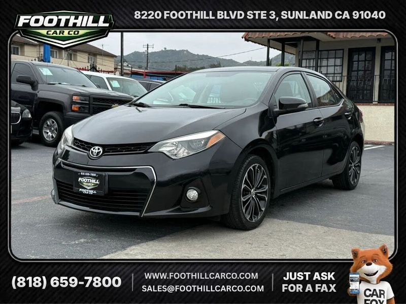 2014 Toyota Corolla — a typically priced live listing