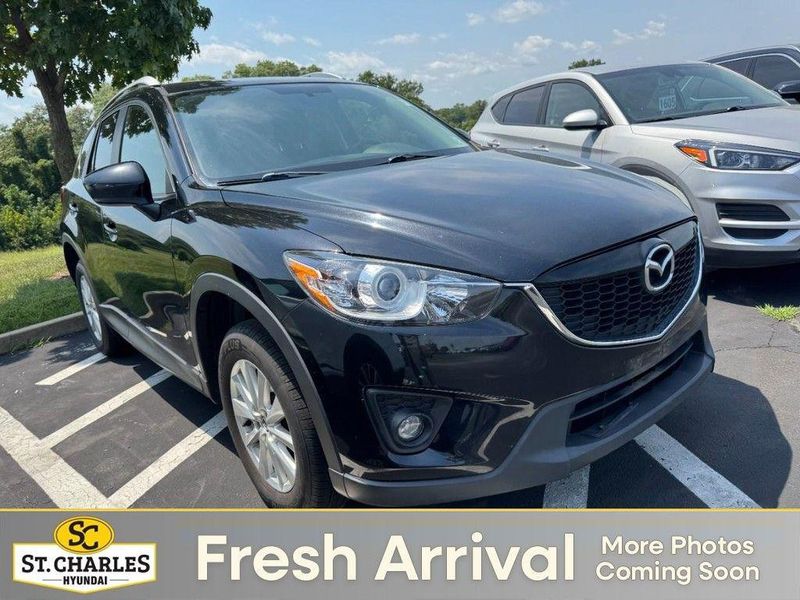 2014 Mazda CX-5 — a typically priced live listing