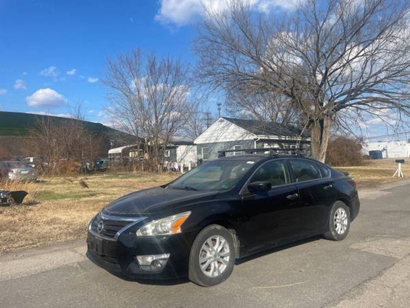 2014 Nissan Altima — a typically priced live listing