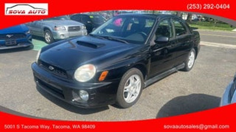 2002 Subaru Impreza — a typically priced live listing