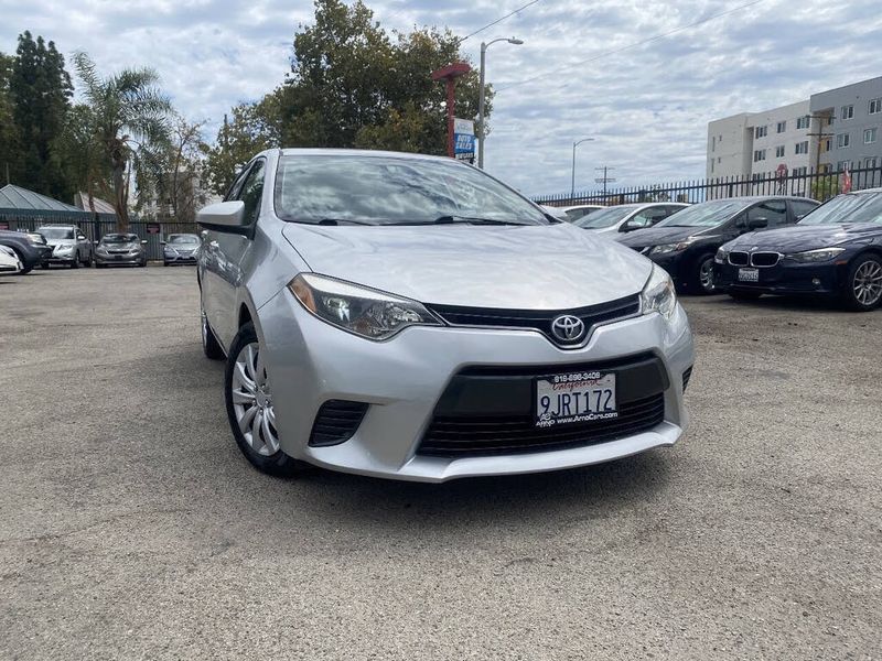 2015 Toyota Corolla — a typically priced live listing